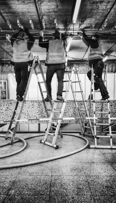 three-worker-adjusting-cable-ceiling